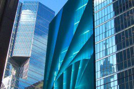 A blue building with many windows in the background.