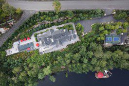 A bird 's eye view of a house with trees around it.