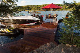 A boat dock with several boats parked on it.